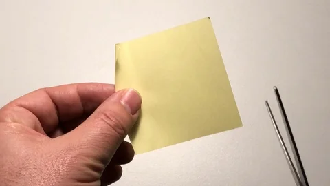 Cutting yellow post it Stock Footage 122097718