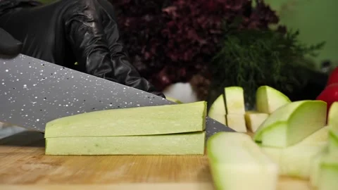 Cutting Zucchini into Batons with Kitchen Knife Stock Footage 311543924