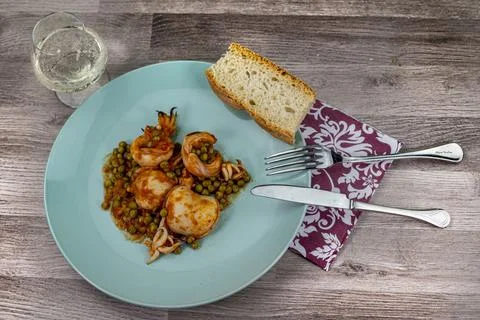 Cuttlefish and peas dish composition Stock Photos