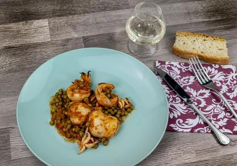 Cuttlefish and peas dish composition Stock Photos
