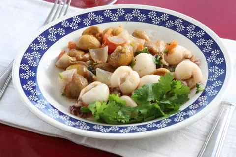 Cuttlefish dish with chestnuts. Stock Photos