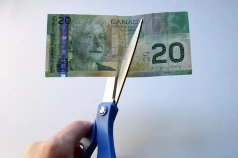 Cuuting money Stock Photos