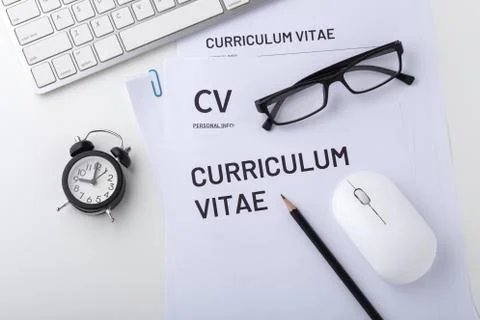 CV, curriculum vitae with clock, computer keyboard and mouse, job interview,  Фото