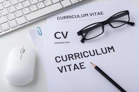 CV, curriculum vitae with computer keyboard and mouse, job interview Stock Photos