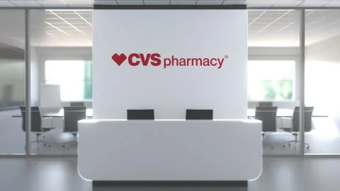 CVS PHARMACY logo above reception desk in the modern office, editorial Ilustración de archivo