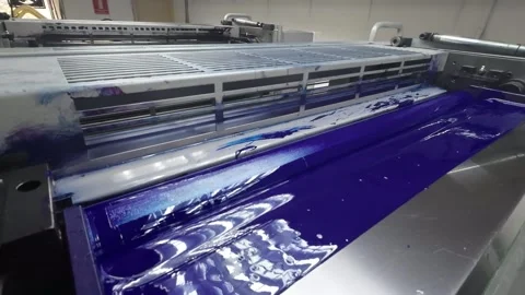 Cyan ink in action within an offset printing press showcasing vibrant color Stock Footage 310589372