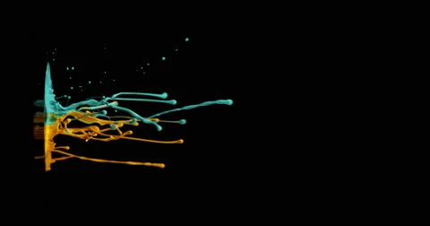 Cyan &amp; mustard paint in motion in 4K Stock Footage 59921387