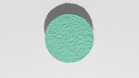 Cyan powder in circular pattern with fluctuating shadow Stock Footage 342563280