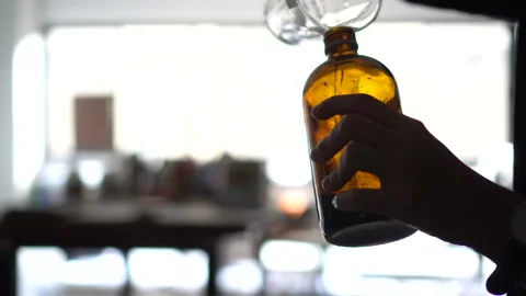 Cyanotype process of mixing substances in dark room for print making art Stock-Footage 153532076