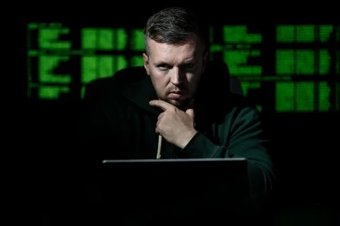 Cyber attack hacker uses computer. Cyber attack hacker writes malicious code Stock Photos