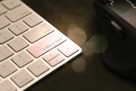 Cyber attack key on keyboard. Mouse in background, computer security 写真素材