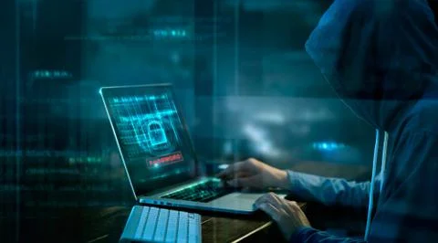 Cyber attack or computer crime hacking password on a dark background. Stock Photos