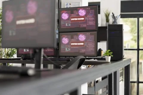 Cyber attack warning on screens in vacant IT office Stockfoto's