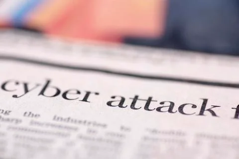 Cyber attack written newspaper Stock Photos