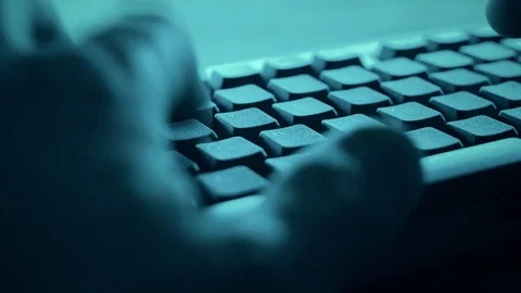 Cyber-attacks hacker installing spyware on pc Stock Footage 75400585