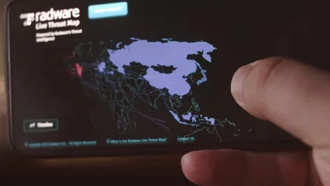Cyber attacks over world map. Camera shot mobile screen. Cyber security concept. Stock Footage 249803324