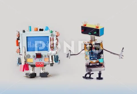 Cyber crime concept. IT specialist robot serviceman with screwdrivers looking at Stock Photos