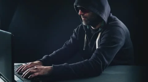 Cyber crime, hacker man typing on laptop computer 库存影片 56237055