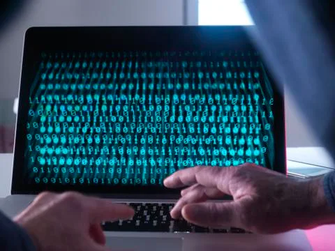 Cyber Crime, laptop computer being hacked Stock Photos