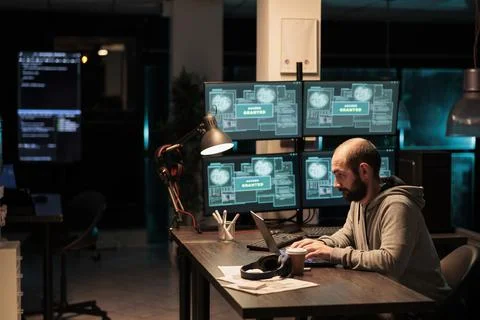 Cyber criminal hacking system at office 스톡 사진