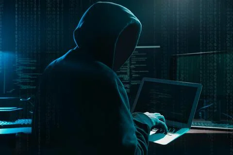 Cyber criminal hacking system at table, digital binary code on foreground 스톡 사진