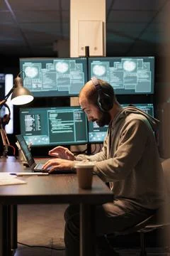 Cyber criminal trying to hack computer server Stock Photos