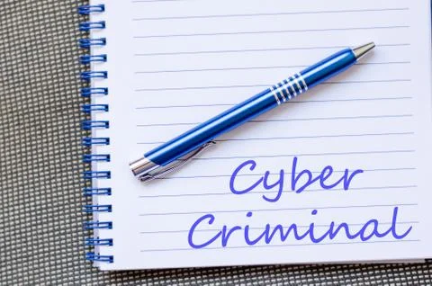 Cyber criminal write on notebook Stock Photos