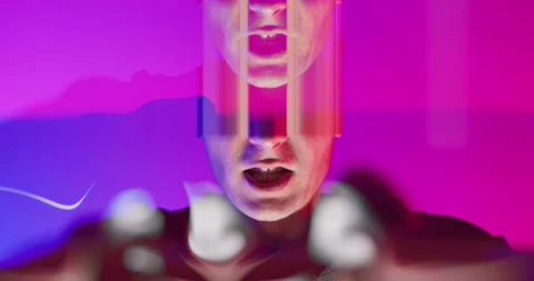 Cyber Glitch Background with a Young Man Playing on a Game Console. Stock Footage 150834245