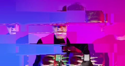Cyber Glitch Background with a Young Man Playing on a Game Console. Stock Footage 150835180