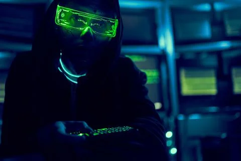 Cyber hacker breaks into databases to obtain information using a computer. Stock Photos