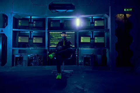 Cyber hacker breaks into databases to obtain information using a computer. Stock Photos