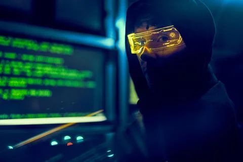 Cyber hacker breaks into databases to obtain information using a computer. Stock Photos