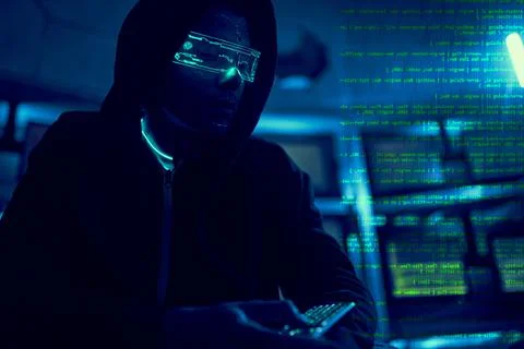 Cyber hacker breaks into databases to obtain information using a computer. Stock Photos
