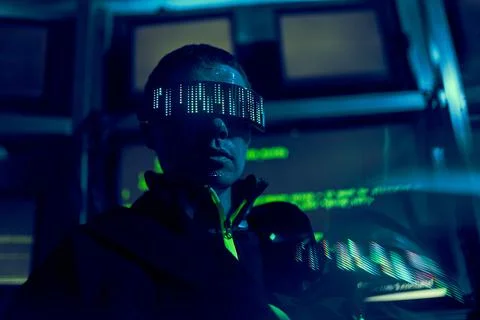 Cyber hacker breaks into databases to obtain information using a computer. Stock Photos