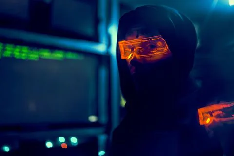 Cyber hacker breaks into databases to obtain information using a computer. Stock Photos