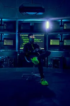 Cyber hacker breaks into databases to obtain information using a computer. Stock Photos