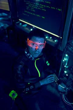 Cyber hacker breaks into databases to obtain information using a computer. Stock Photos