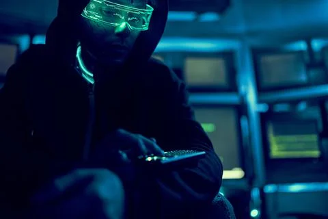 Cyber hacker breaks into databases to obtain information using a computer. Stock Photos