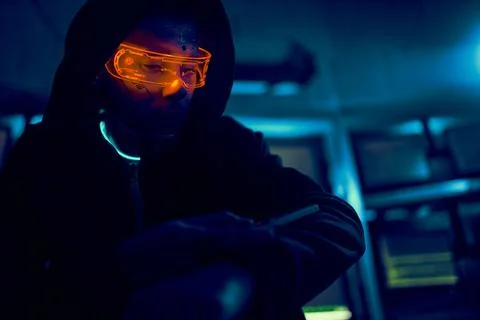 Cyber hacker breaks into databases to obtain information using a computer. Stock Photos