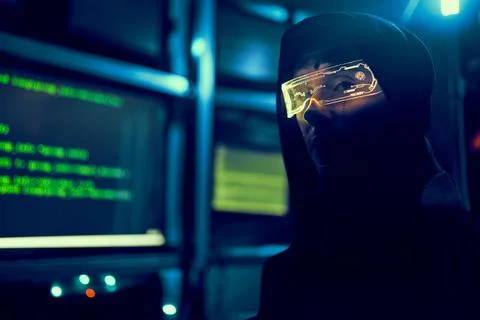 Cyber hacker breaks into databases to obtain information using a computer. Stock Photos