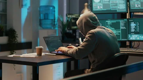 Cyber impostor with anonymous mask breaking security system Stock Footage 221523424
