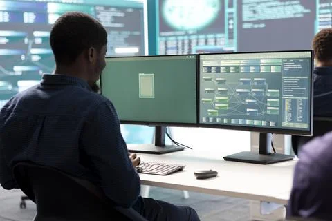 Cyber intelligence group of experts in a governmental hacking room Stock Photos