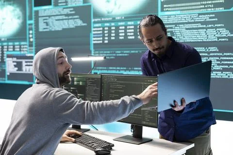 Cyber intelligence team using advanced technology to secure computer networks Foto stock