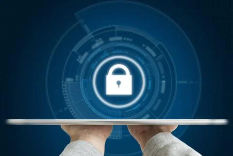 Cyber internet security system. Hand holding tablet and security lock icon Stock Photos