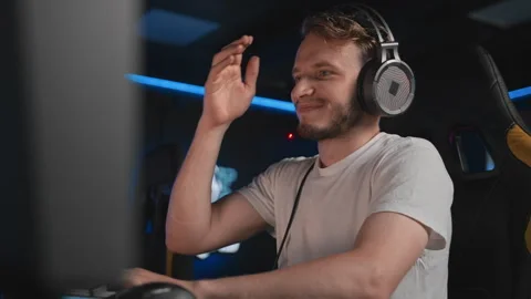 Cyber player loses match and he hits his forehead with his palm, facepalm Stock Footage 303620256