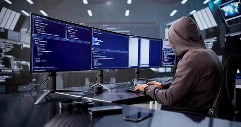 Cyber Programmer Caught Red-Handed During Identity Theft At Office Stock Photos