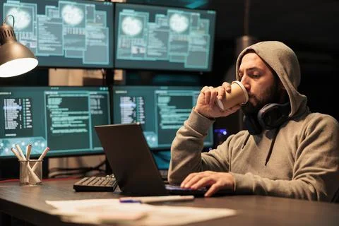 Cyber scammer hacking system to destroy information Stock Photos