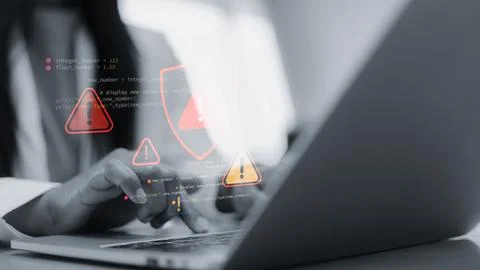 Cyber security alert with red warning icons on laptop screen.Hacker attack .. Stockfoto's