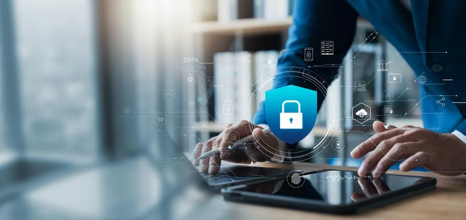 Cyber ??security and data protection, businessman using laptop and tablet I.. Stock Photos