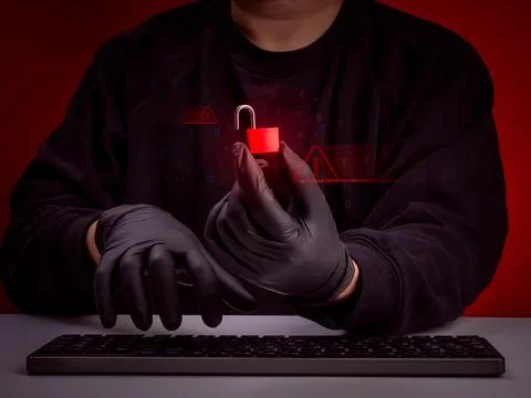 Cyber security concept with anonymous hacker holding red unlocked padlock a.. 写真素材